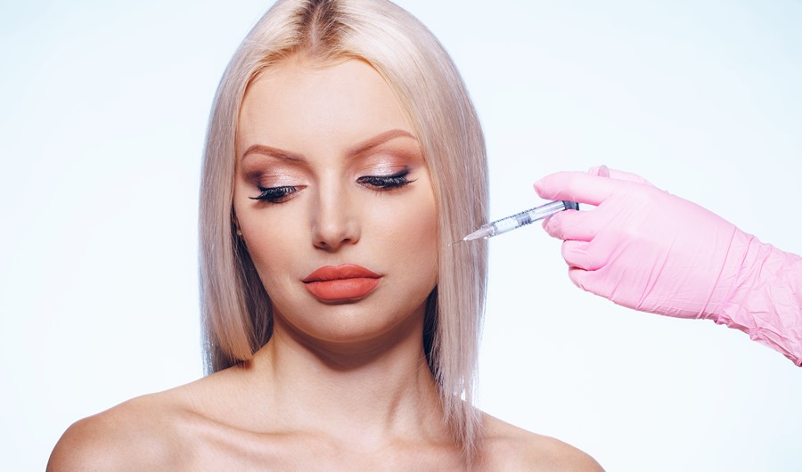 Portrait of young Caucasian woman. Concept of botox cosmetic injection